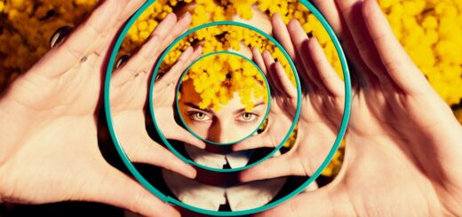 photo of woman holding a mirror